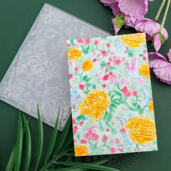 Floral embossing folder with floral design on a green background