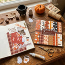 Autumn-themed scrapbooking set with paper, scissors, and decorative items on a wooden surface.