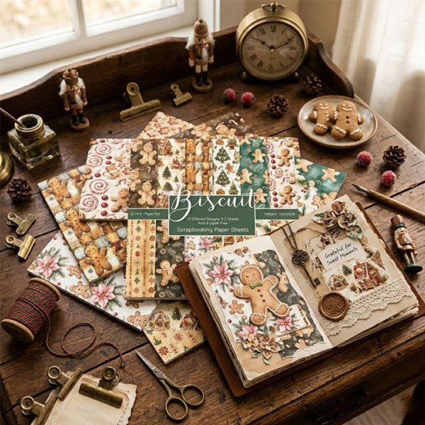 A styled flat-lay of Biscuit Paper Co's Christmas Gingerbread-themed paper sheets and scrapbook papers arranged on a rustic wooden table with vintage props including an alarm clock, scissors, and a small window.