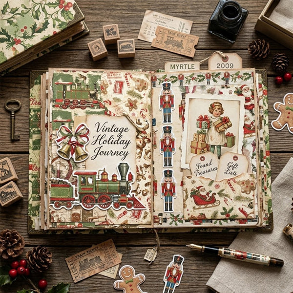 An open vintage-style scrapbook or journal spread laid on a wooden surface, filled with layered paper sheets, stamps, tickets, a green train illustration, holiday motifs, and handwritten labels reading 'Vintage Holiday Journey' and 'MYRTLE 2009.' Surrounding props include pinecones, holly, a key, a pen, and additional paper pieces.