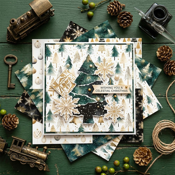 A layered Christmas greeting card with gold snowflakes, green pine trees, and a 'Wishing You A CELESTIAL CHRISTMAS' banner, styled in a flat lay on a dark green wooden background with vintage toy trains, pinecones, a key, beads, and a small camera.