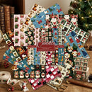 A collection of Christmas-themed scrapbooking paper sheets and coordinating washi tape rolls featuring dog illustrations in holiday outfits, arranged on a wooden table with scissors, a ruler, and a small gift box. The brand name 'Cuddle' is visible on the central label.