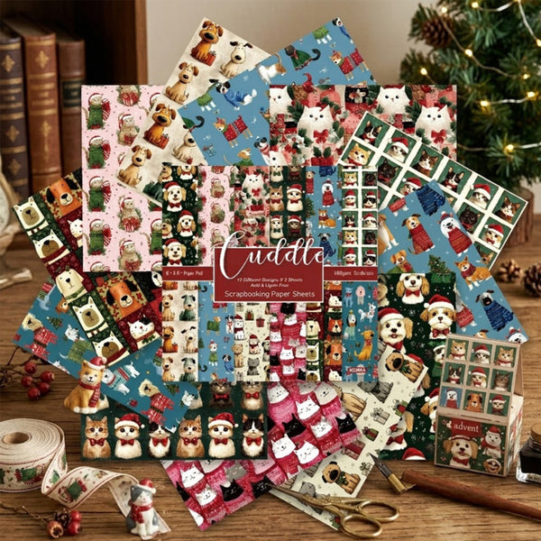 A collection of Christmas-themed scrapbooking paper sheets and coordinating washi tape rolls featuring dog illustrations in holiday outfits, arranged on a wooden table with scissors, a ruler, and a small gift box. The brand name 'Cuddle' is visible on the central label.