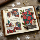 An open journal spread on a rustic wooden table, decorated with Christmas-themed collage pages including Santa illustrations, red poinsettias, pinecones, stamps, and handwritten notes. Surrounding props include paper cutouts, gold fasteners, ink, and a pen.