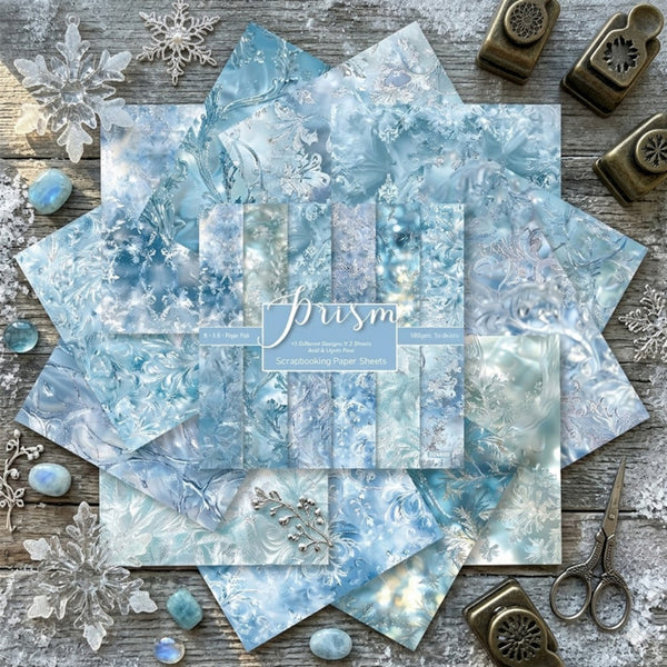 Collection of blue marbled paper sheets with decorative elements on a wooden surface.
