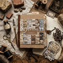 Scrapbooking paper sheets with rustic design on a wooden surface with vintage items.
