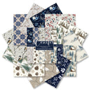 A fan arrangement of multiple patterned paper sheets with winter and nature motifs, including snowflakes, birds, pinecones, trees, cabins, and floral designs. A central label reads 'conifer' and '12 Coaster Papers & Sheets'.