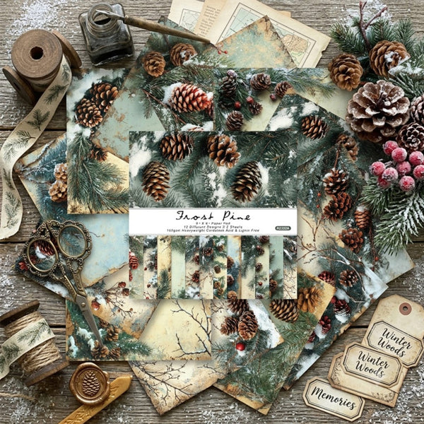 A styled flat-lay of a paper craft scrapbook paper pack titled 'Front Pine' by Paper Paradise. The product is displayed with its packaging label in the center, surrounded by thematic decorative props including pinecones, faux snow-dusted pine branches, vintage scissors, ribbon, and wooden tags on a rustic wooden surface.