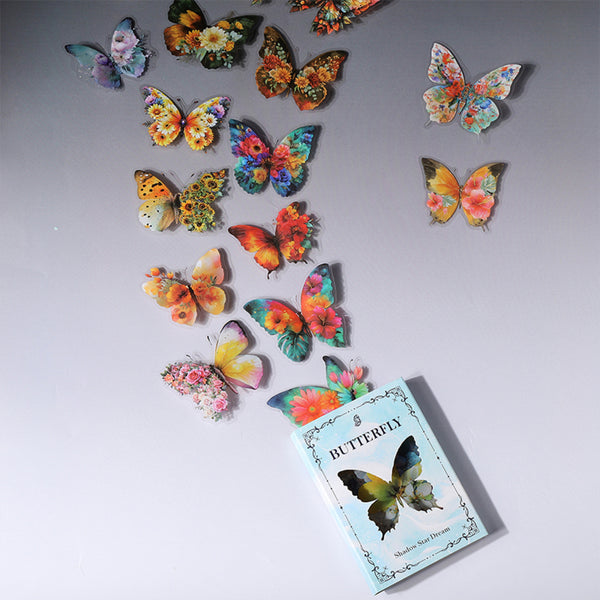 A set of colorful butterfly wall decals arranged on a light gray background, with a small book titled "BUTTERFLY" placed near the bottom right.