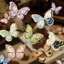 Colorful paper butterflies on a blurred background