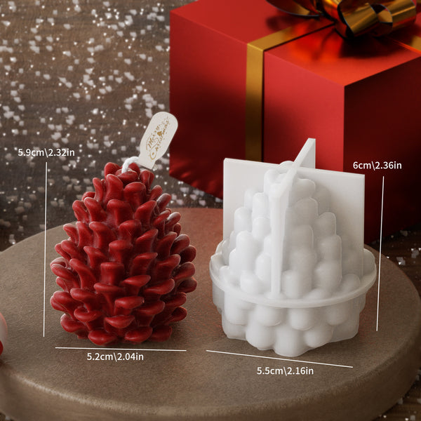 Red pine cone-shaped candle and white bubble-patterned candle mold on a round surface with measurements displayed.