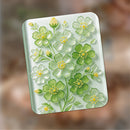 Decorative card with green floral design on a blurred background
