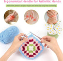 Ergonomic handle for arthritic hands being used with crochet work on a white background.