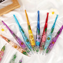 Colorful crochet hooks with floral designs on a white background