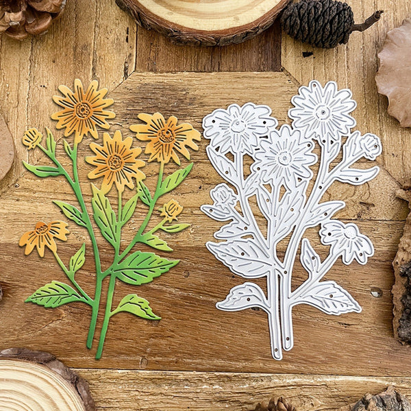 Metal floral cutting dies on a wooden surface with natural elements.
