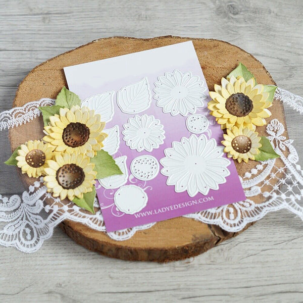 Card with sunflower decorations on a wooden surface