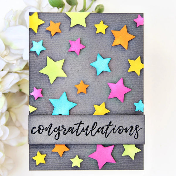 Card with colorful stars and 'congratulations' text on a floral background