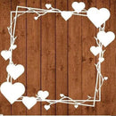 Decorative white heart and branch frame on a wooden background