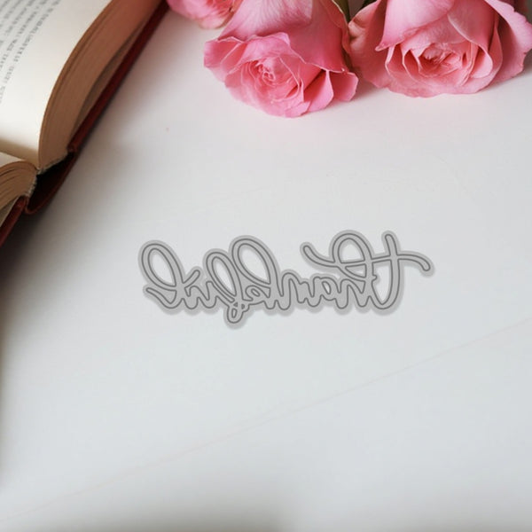 Decorative cutout of 'forever' with pink roses on an open book