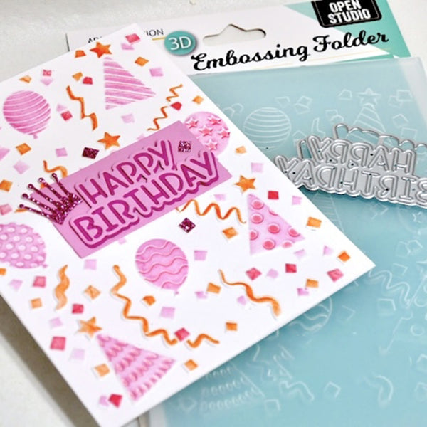 A 3D embossing folder set featuring a white card with pink and orange birthday party illustrations and a silver metal 'HAPPY BIRTHDAY' die-cut embosser, shown next to a light blue plastic folder with matching embossed shapes. The packaging reads 'Open Studio' and '3D Embossing Folder'.