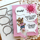 A handmade western-themed mouse card featuring a cartoon mouse in a cowboy outfit, speech bubbles reading 'Howdy!', 'BOOTS, LACE AND A WHOLE LOT OF GRACE', and 'Cowgirls just wanna have fun!', alongside pink sequin embellishments and a scalloped pink card base, shown on a white lace doily with metal die-cutting templates.