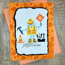 A handmade greeting card featuring a cartoon construction worker with a yellow hard hat, safety vest, and boots, holding a 'DIG YOU!' sign. The card has an orange patterned border and the text 'CONCRETE proof you're the best'.