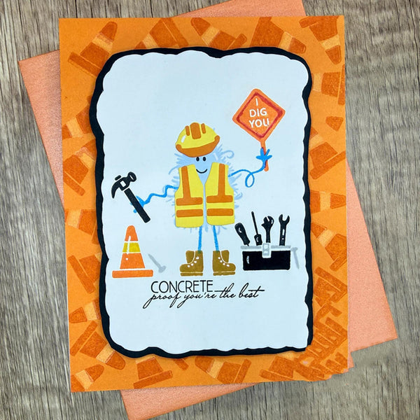 A handmade greeting card featuring a cartoon construction worker with a yellow hard hat, safety vest, and boots, holding a 'DIG YOU!' sign. The card has an orange patterned border and the text 'CONCRETE proof you're the best'.