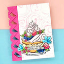 A handmade greeting card featuring a colorful illustration of a dessert with strawberries, blueberries, and flowers, with the text 'LIFE IS SHORT. EAT DESERT FIRST!'.