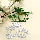 A metal die-cut craft embellishment featuring green palm trees on a beige background, with a matching silver metal cutting template shown below and decorative white flowers in the upper left corner.