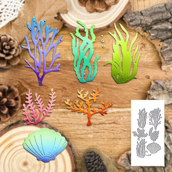 A set of colorful metal coral and seashell craft dies arranged on a rustic wood background, with a small inset showing the gray die-cut outline sheet.