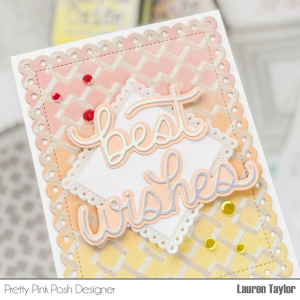 A handmade greeting card with layered pastel pink, peach, and yellow geometric patterns, scalloped borders, and an embossed die-cut script reading 'best wishes.' Small red and yellow rhinestones are placed on the card.