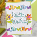 A handmade Easter greeting card with 'Easter Wishes' in raised script, decorated with colorful paper butterflies and flowers on a white background.