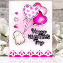 A handmade Valentine's Day greeting card featuring a cute ghost, pink and white patterned balloons, and the text 'Happy Valentine's Day' in black script, styled with white flowers in the background.