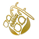 A gold-colored metal die-cut embellishment featuring the word 'celebrate' in cursive script surrounded by floral and leaf motifs, shown on a plain white background.