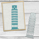 A teal silhouette of the Leaning Tower of Pisa shown on a kraft card with a dashed border, alongside a matching metal die-cut sticker or stamp piece on a whitewashed wood background.