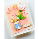A handmade greeting card featuring a cute cartoon mouse wearing a blue jacket, a large white flower with green leaves, pink butterflies, and the word 'hello' in gold. The card has a peach watercolor background and is mounted on a white textured cardstock.