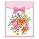 A handmade greeting card featuring a layered floral design with pink, orange, blue, and yellow roses, green leaves, a pink bow, and a tan banner that reads 'makes life glow'.