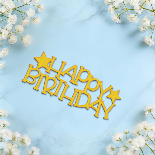 Gold laser-cut wooden 'HAPPY BIRTHDAY' sign with star accents, displayed on a light blue marble background framed by white baby's breath flowers.