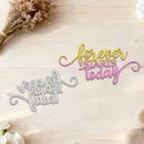 Decorative metal signs with 'forever starts today' and 'now is that date?' text on a wooden surface with flowers.