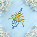 A colorful metal wall art piece depicting a stylized plant in a blue pot, displayed on a light blue marble background with white baby's breath flowers in the corners.