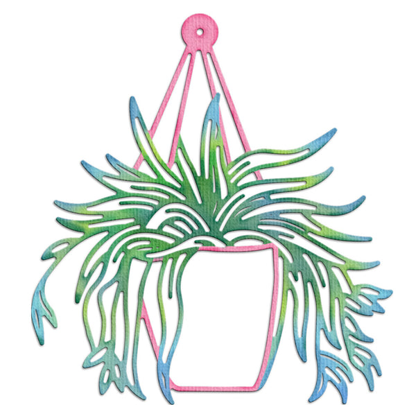 A decorative metal wall hanging featuring a pink pot and hanger frame with a green and blue gradient leafy plant silhouette, shown on a plain white background.
