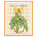 A handmade greeting card featuring a green hanging plant with a yellow plaid bow, set against a peach and yellow plaid background with the text 'love IN EVERY detail'.