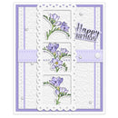 A handmade square greeting card with a white textured background, layered white scalloped borders, light purple side panels, three floral inserts showing lavender flowers with green stems, a purple ribbon across the middle, and a 'Happy Birthday' message on the right.