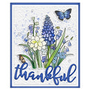 A square handmade card featuring blue and white wildflowers, a blue butterfly, and the word 'thankful' in blue script at the bottom, set against a white background with a blue border.