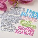 A set of colorful laser-cut paper dies and matching sample cutouts on a light background, with pink flowers at the top. The cutouts include phrases like 'Happy Birthday,' 'You Are Beautiful,' 'Related Birthday Wishes,' and 'Hip, Hip HOORAY!' in blue, pink, and green.