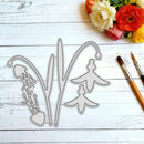 A set of metal die-cut craft shapes for wildflower or botanical designs, arranged on a white wood plank surface with flowers and two paintbrushes nearby.