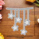A metal die-cutting template for hanging star decorations, shown on a wooden surface with black measurement lines and text indicating dimensions of 5.3cm by 5.