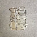 A set of six metal cookie cutters shaped like coffee and tea vessels, including a moka pot, teapot, coffee bean bag, French press, mug, and cup, arranged on a textured light beige surface.