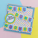 A colorful handmade paper banner set on a layered card, featuring the words 'WELL DONE' and 'WOOHOO' in alternating pastel blue, yellow, and pink flags, plus a circular badge that says 'You Passed!'. The card is photographed on a pastel-colored background with blue, pink, and yellow sections.