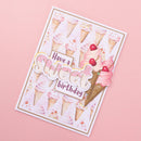 A handmade birthday card with a pink and white ice cream theme, featuring 3D layered ice cream cones and the text 'Have a Sweet Birthday' on a light pink background.